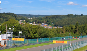 A panoramic view of Spa-Francorchamps circuit surrounded by the forests of the Ardennes